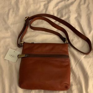 Fossil tan/ medium brown cross body bag.